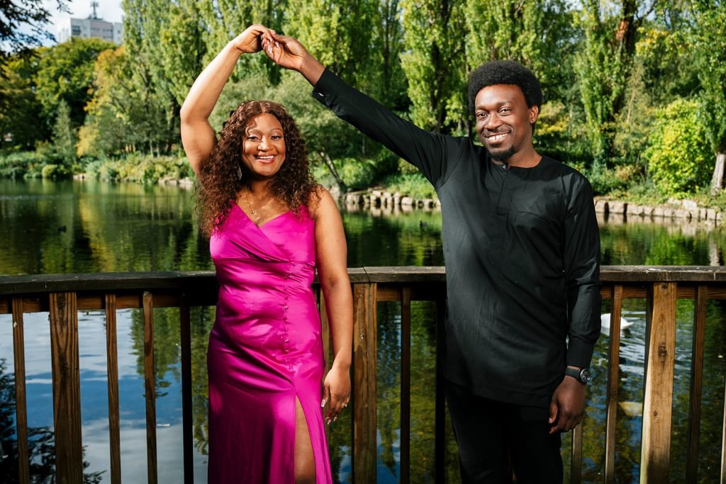 Couple dancing by the serene lake.